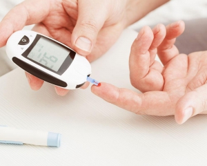 Person testing their blood sugar with meter