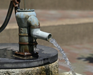 A water well releasing a stream of water