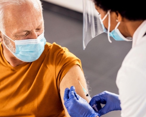 Elderly man receiving vaccine