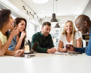 Group of people in recovery talking at table