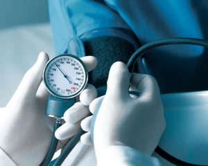 Blood pressure cuff reading a patient's vitals