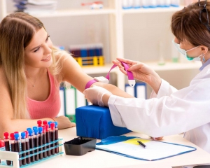 Nurse performing a blood test on patient