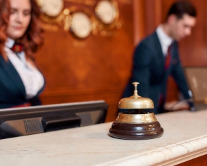 Hotel employees working behind desk